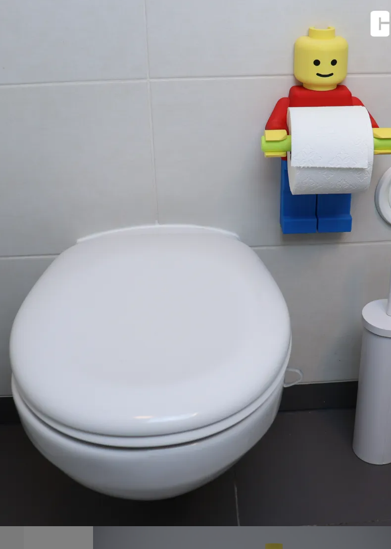 Lego man toilet paper holder come with hair, cowboy hat, tp hat and 2 diferent holder