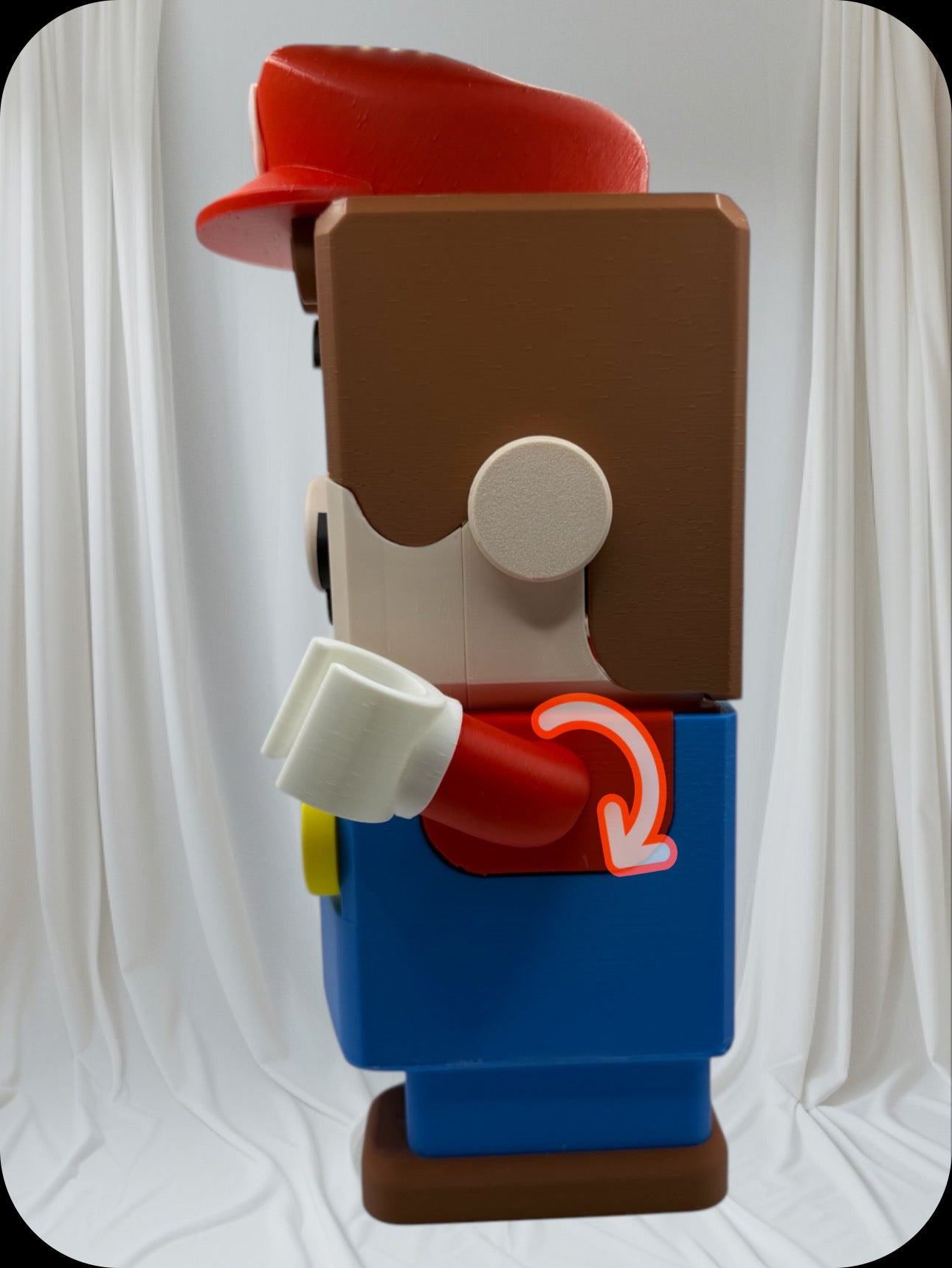 Super Mario tissue box Mario" This Mario comes with a controller holder, you could place a tissue box